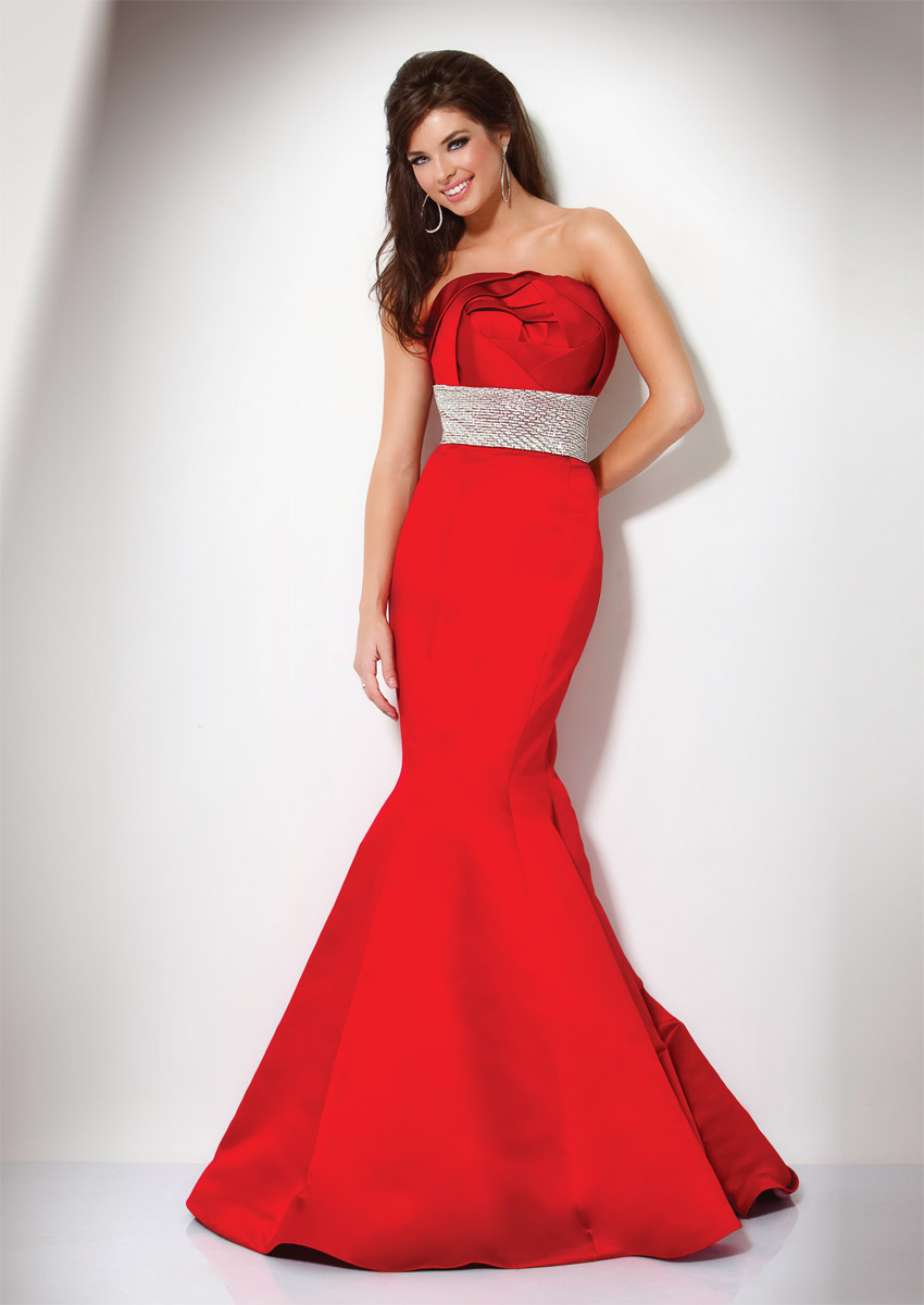 Strapless red dress Pretty dress from Monsoon. The dress is Strapless & tea-length with a side zip and sash which ties in a bow at the back. Size #dress.